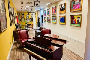 An extension of our lobby that joins our concession area. A great place to relax and browse our exclusive "Yo Mama" art gallery!